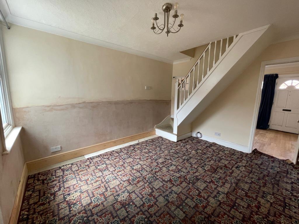 Lot: 43 - THREE-BEDROOM SEMI-DETACHED HOUSE FOR IMPROVEMENT - Dining room with stairs to first floor